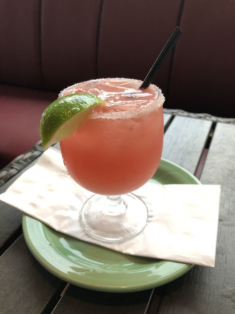 CLOSE-UP OF COCKTAIL WITH JUICE ON TABLE