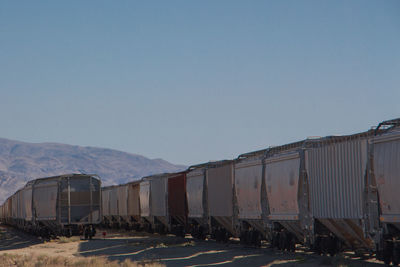 Train on railroad track against clear sky