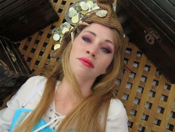 Overhead view of woman with make-up lying on table