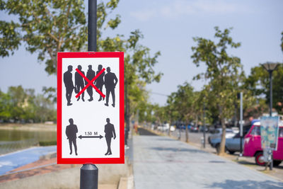 Close-up of road sign on street