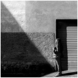 Shadow of man walking on street