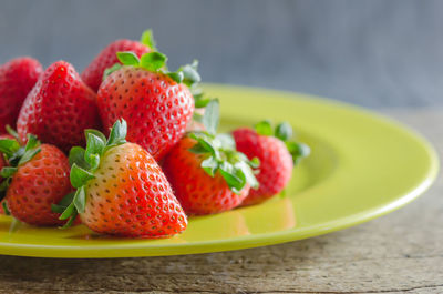 Close-up of strawberries in plate on table