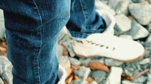Low section of man standing outdoors