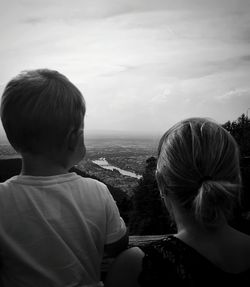 Rear view of man and woman looking at view