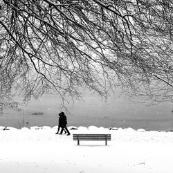 People on snow covered field during winter