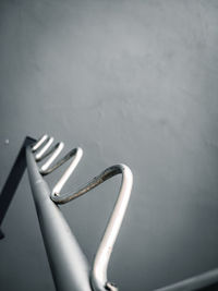 High angle view of metal on table against wall