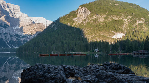 Scenic view of lake and mountains against sky