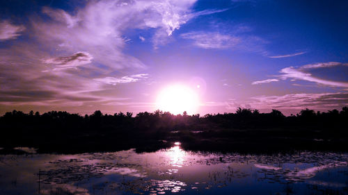 Scenic view of lake against sky during sunset