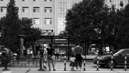 People walking on road in city