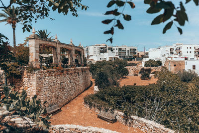Old buildings against sky in city