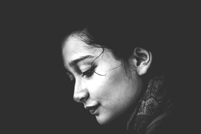 Close-up of young woman in darkroom