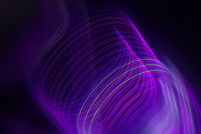 Full frame shot of light painting against black background