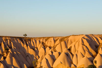 Scenic view of desert against clear sky