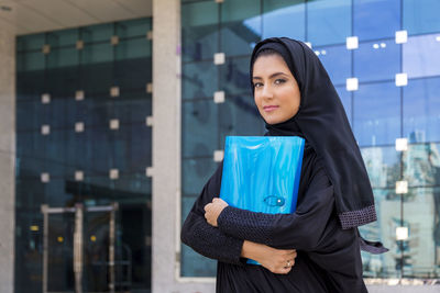 Portrait of woman wearing burka in city