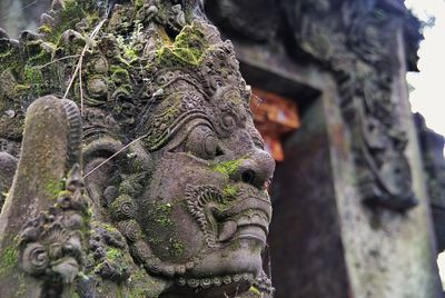 Close-up of old sculpture at pura tirta empul temple