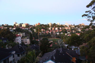 Houses in town against clear sky