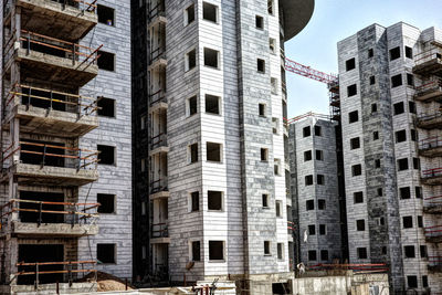 Construction site of buildings in city