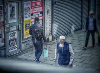 People walking on street in city