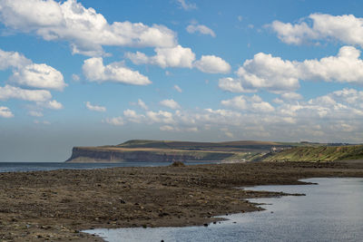 Scenic view of beach against sky