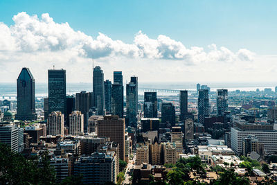 High angle view of buildings in city against sky