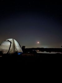 Scenic view of landscape against sky at night