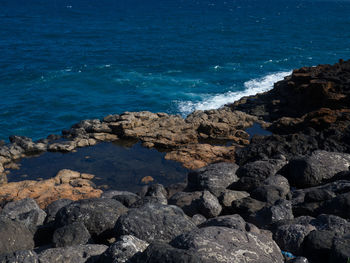 Scenic view of sea against blue sky