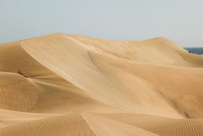 Scenic view of desert against clear sky