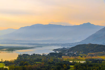 Scenic view of mountains against sky during sunset