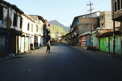 People walking on road in city