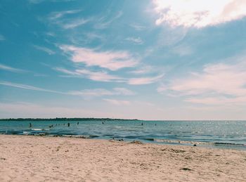 Scenic view of sea against cloudy sky