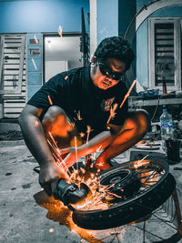 Man working on barbecue grill