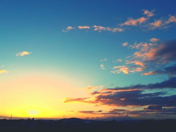 Scenic view of landscape against sky at sunset