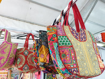 Close-up of clothes hanging on display at store