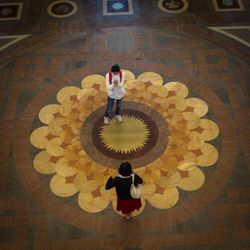 High angle view of man standing in corridor