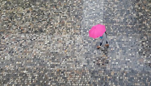 High angle view of woman with umbrella