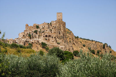 Low angle view of old ruins against clear sky