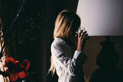 Midsection of woman holding umbrella