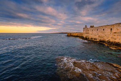 Scenic view of sea against sky during sunset