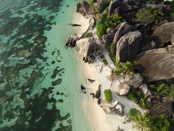 High angle view of rocks by sea