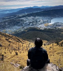 Rear view of man standing on mountain