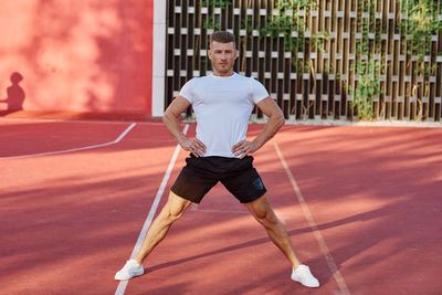 Low section of woman exercising on court