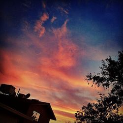 Low angle view of cloudy sky at sunset