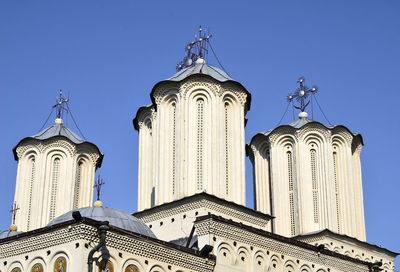 Low angle view of a building against clear blue sky