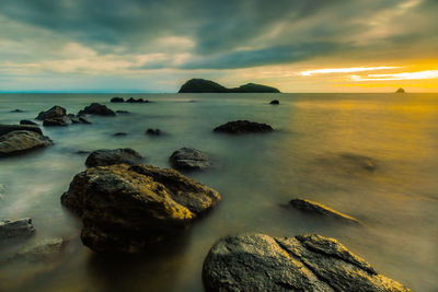 Scenic view of sea against cloudy sky