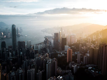 High angle view of modern buildings in city against sky