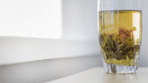 Close-up of glass of jar on table