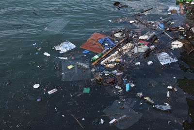 High angle view of garbage floating on water