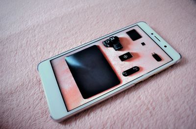 Close-up of dummy phone on rug