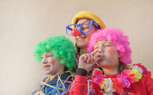 Woman and children wearing costumes during event