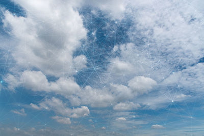 Double exposure of cloudy sky and constellation
